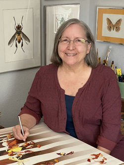 Linda Heath Clark working at desk